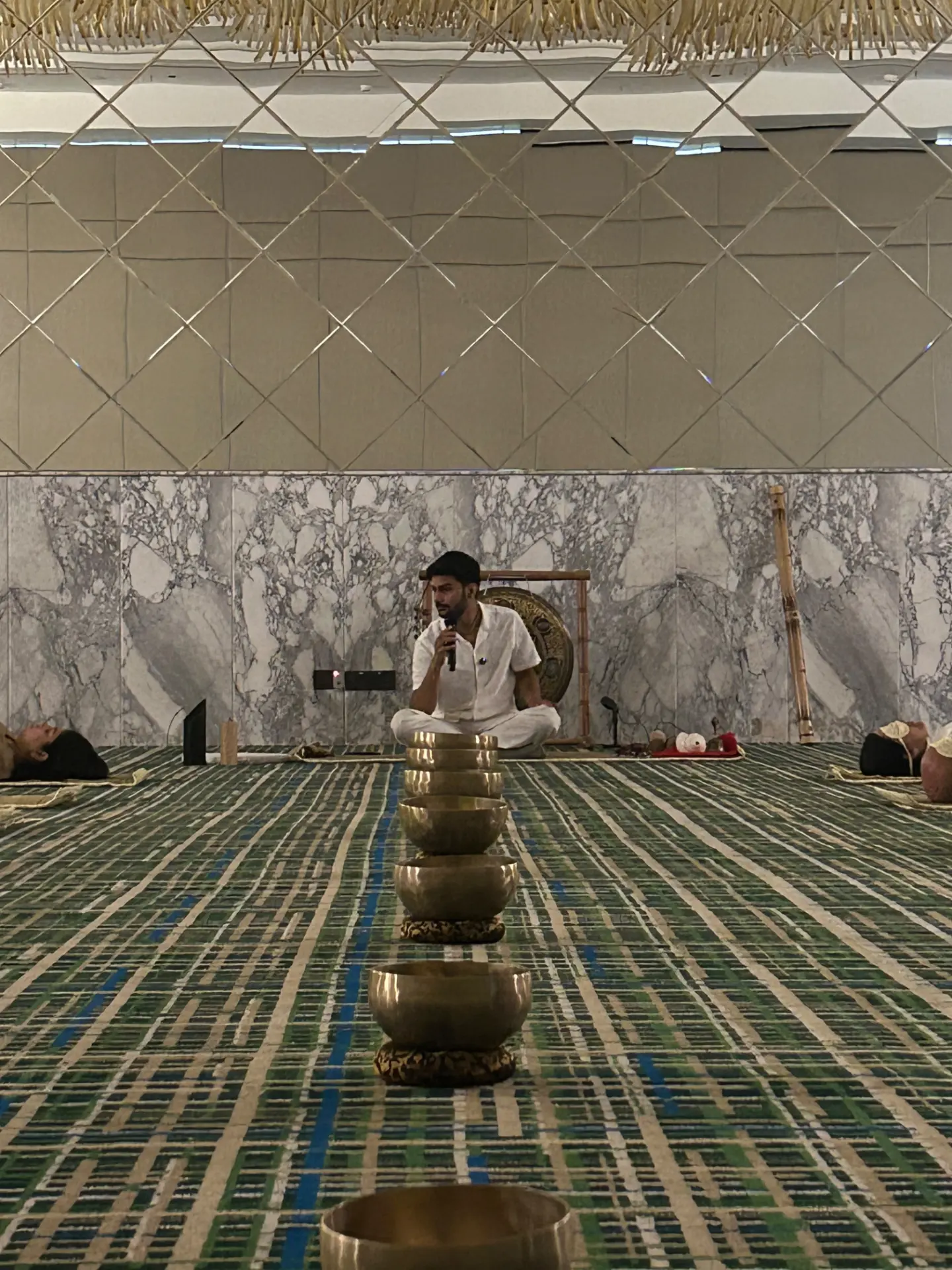 Aditya Panwar guiding a sound session with singing bowls and a gong
