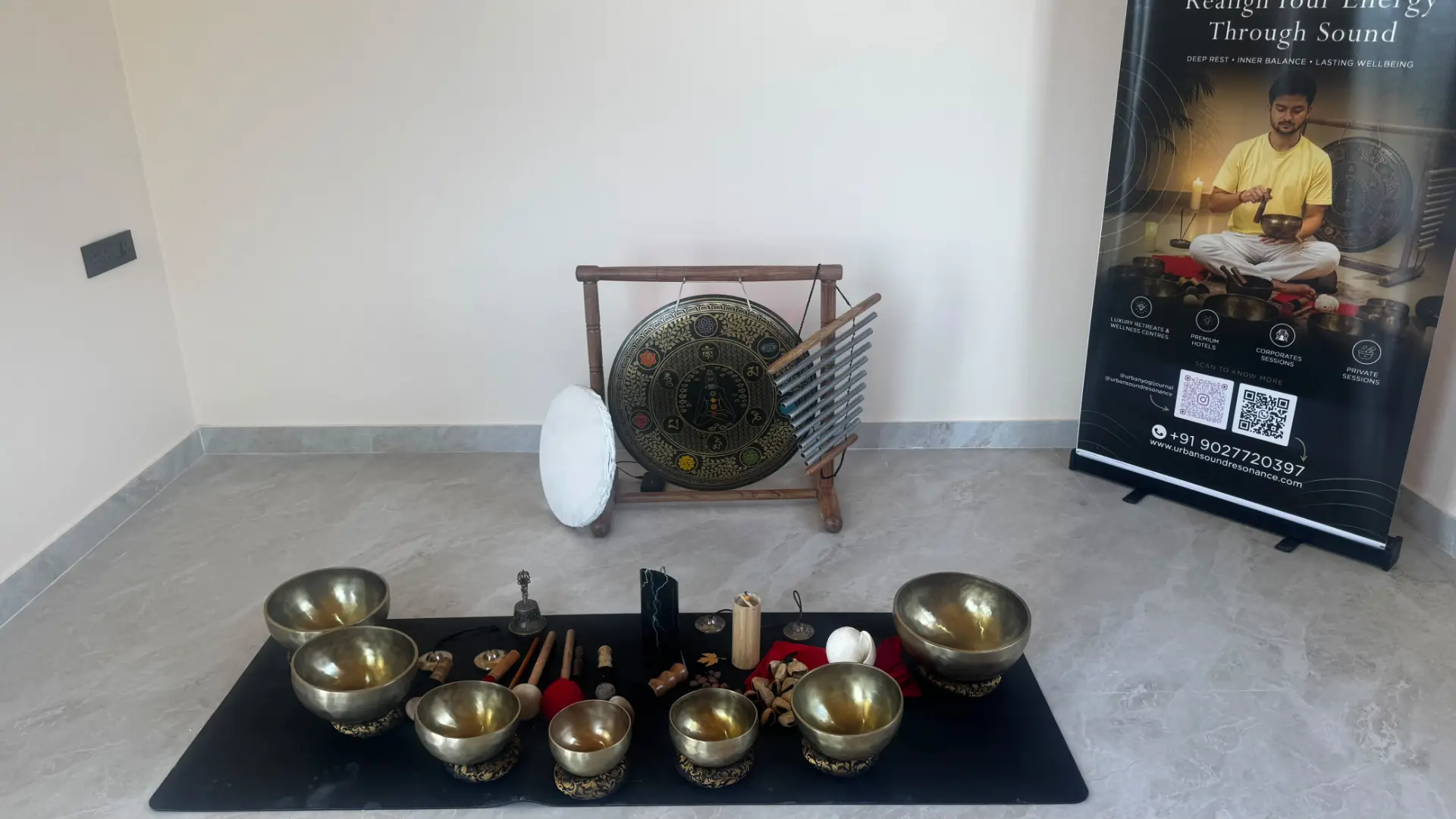 Singing bowls and a gong arranged for a corporate sound bath