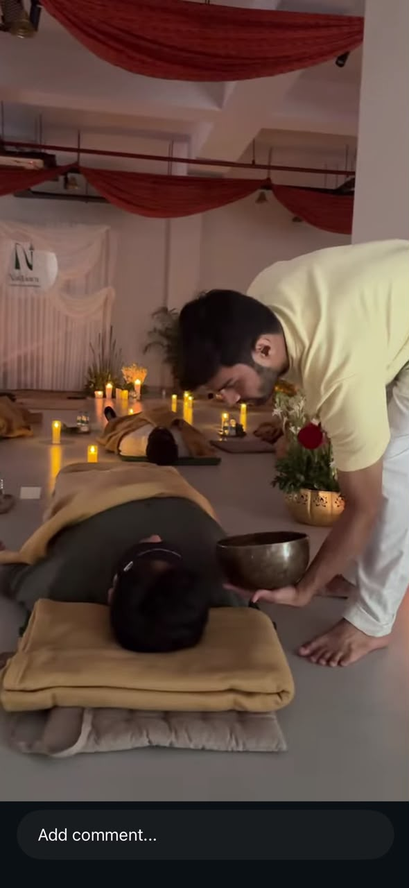 A quiet individual sound bath moment with a singing bowl